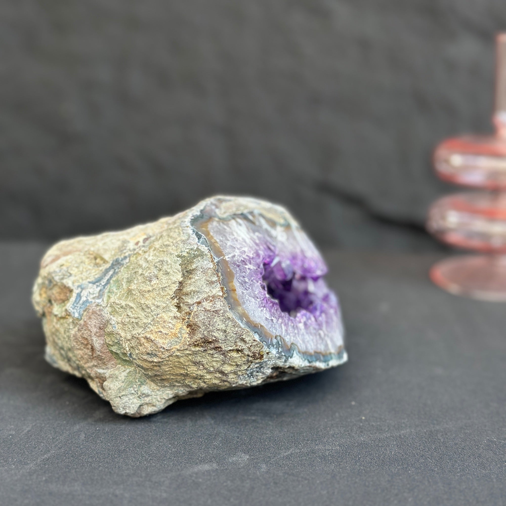 Large Uruguayan amethyst geode with deep purple crystals and agate formations.