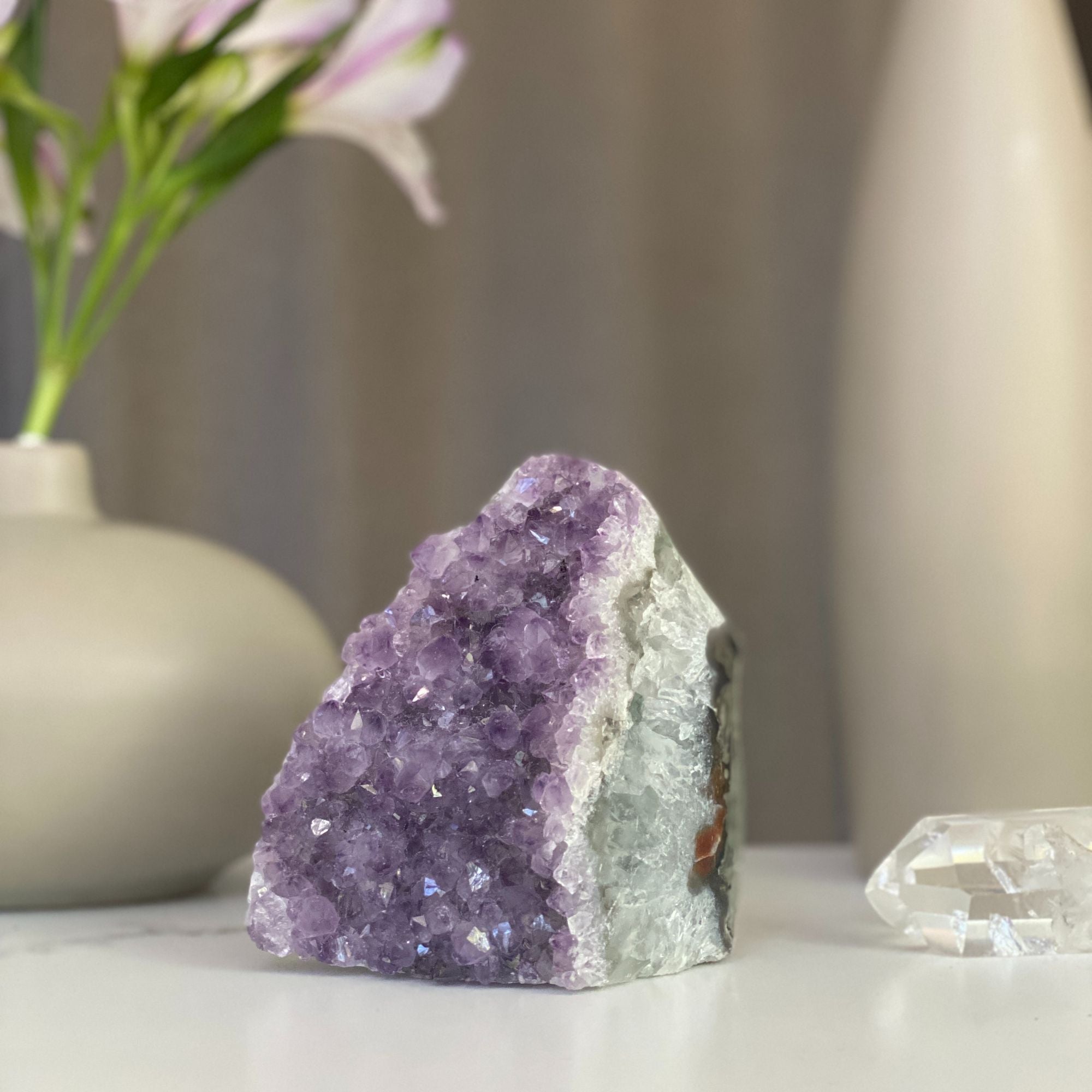 Natural lavender amethyst geode cluster with sparkling purple crystals and unique agate formations.