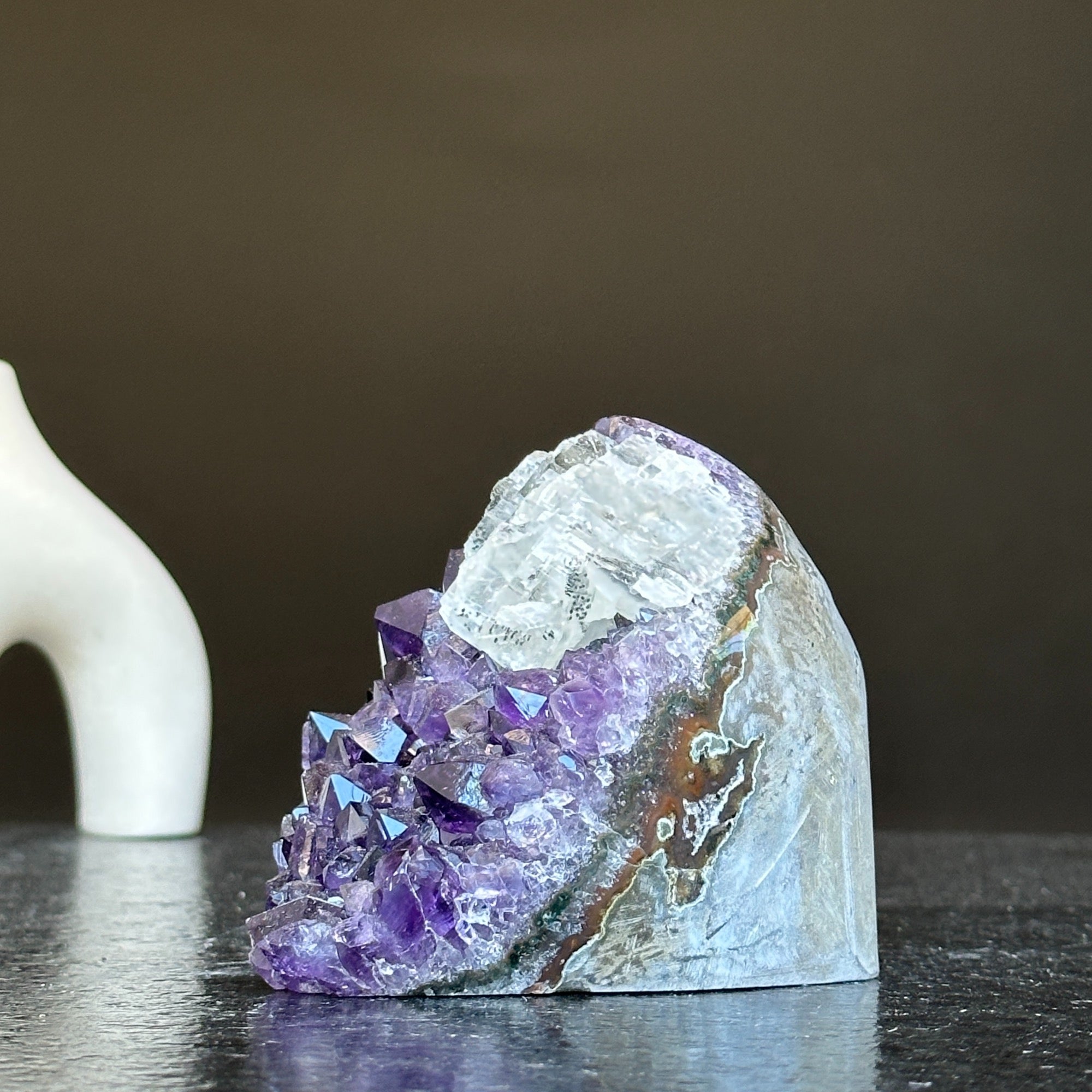 Deep purple Uruguay amethyst crystal geode, 3x3 inches, with raw stone exterior.