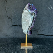 Natural Uruguayan amethyst cave, 6-inch tall, with deep purple crystals on a gold metal stand.