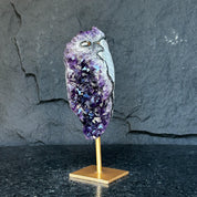 Natural Uruguayan amethyst cave, 6-inch tall, with deep purple crystals on a gold metal stand.