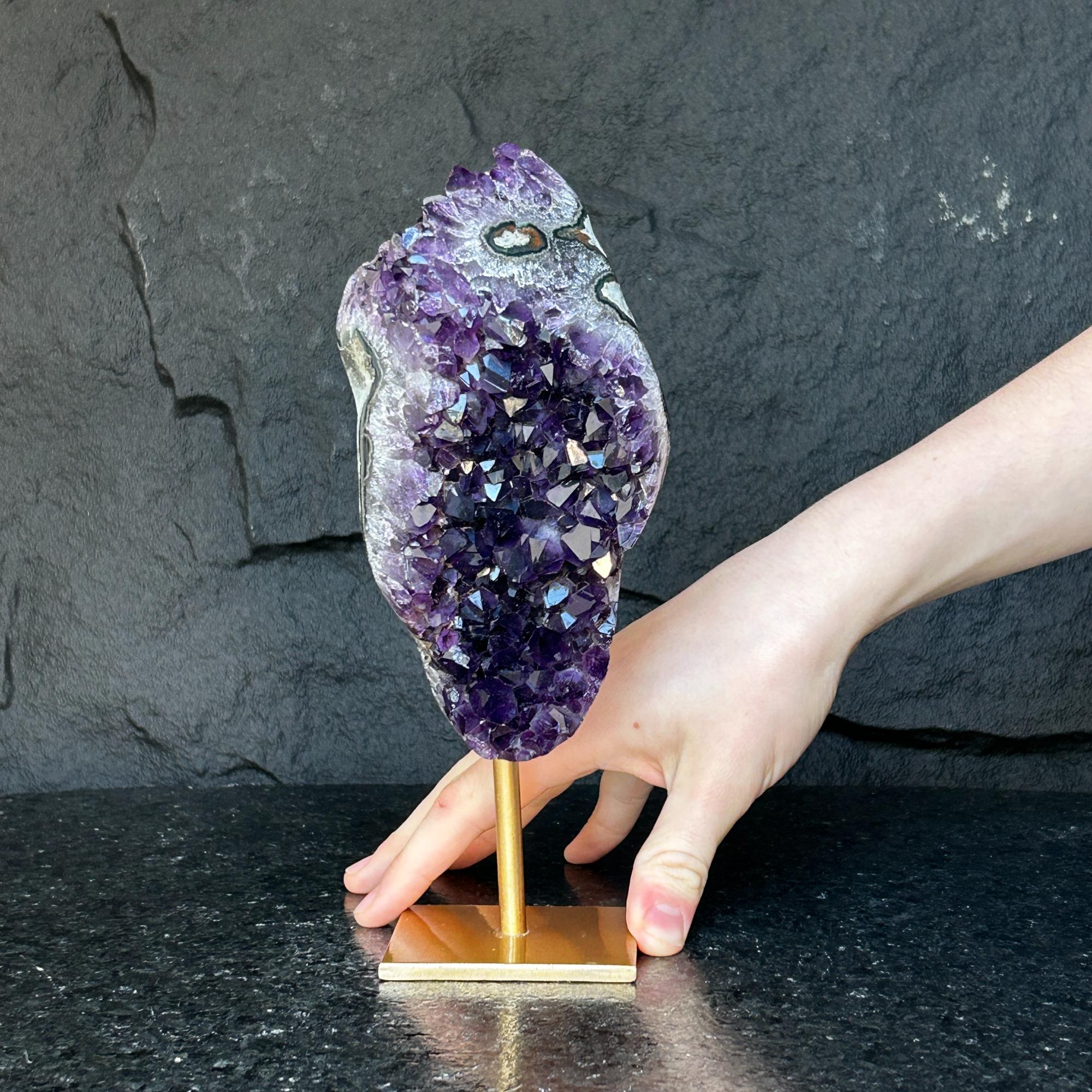 Natural Uruguayan amethyst cave, 6-inch tall, deep purple crystals on a gold metal stand.