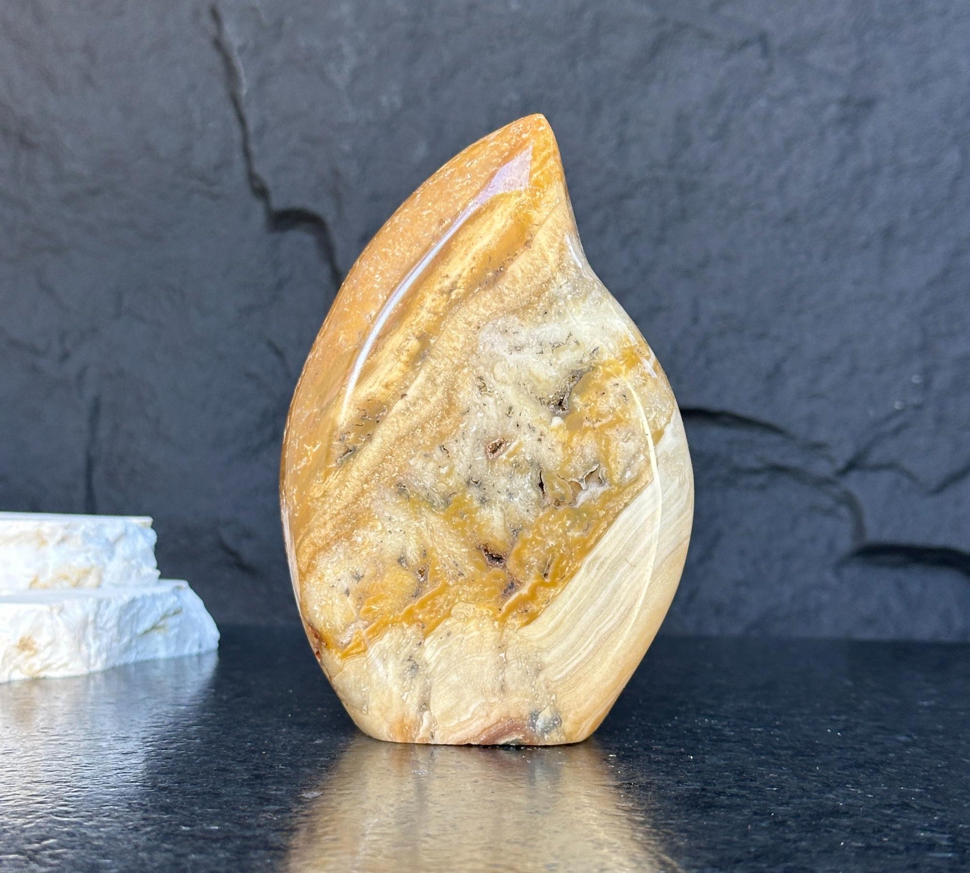 Polished Uruguayan jasper flame, 5.5-inch tall, with natural cream, brown, and orange agate patterns.