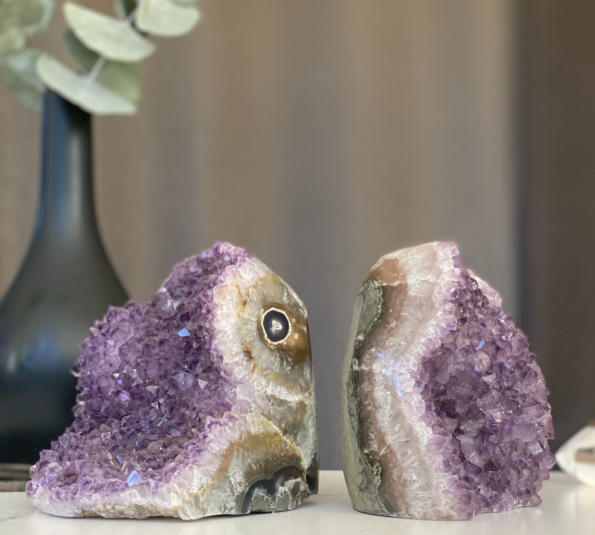 Two large 4.5" galaxy amethyst geodes with deep purple crystals, natural banding, and unique eye formation.