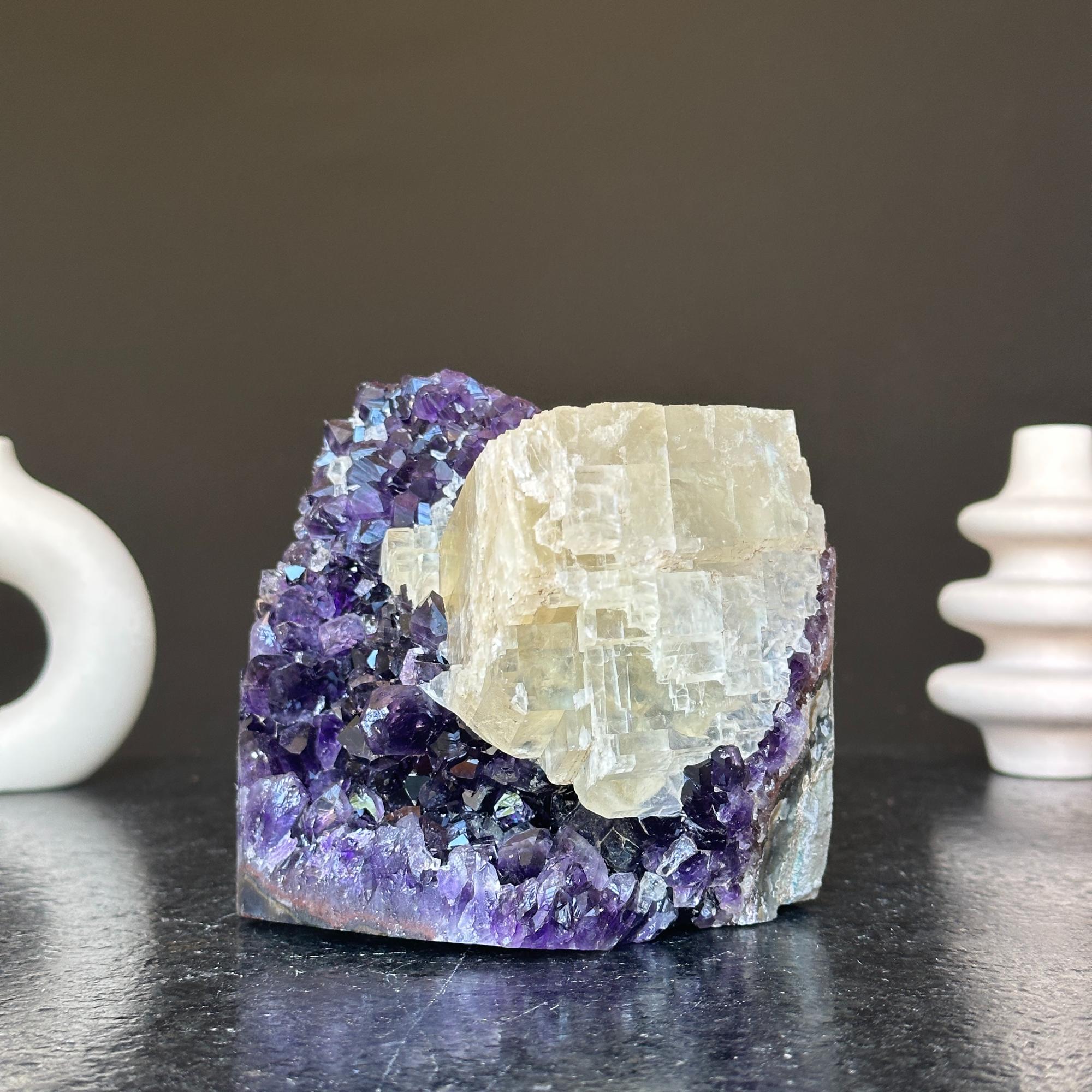 Vibrant deep purple amethyst geode cluster with a prominent creamy white crystal formation, 5.5 inches tall.