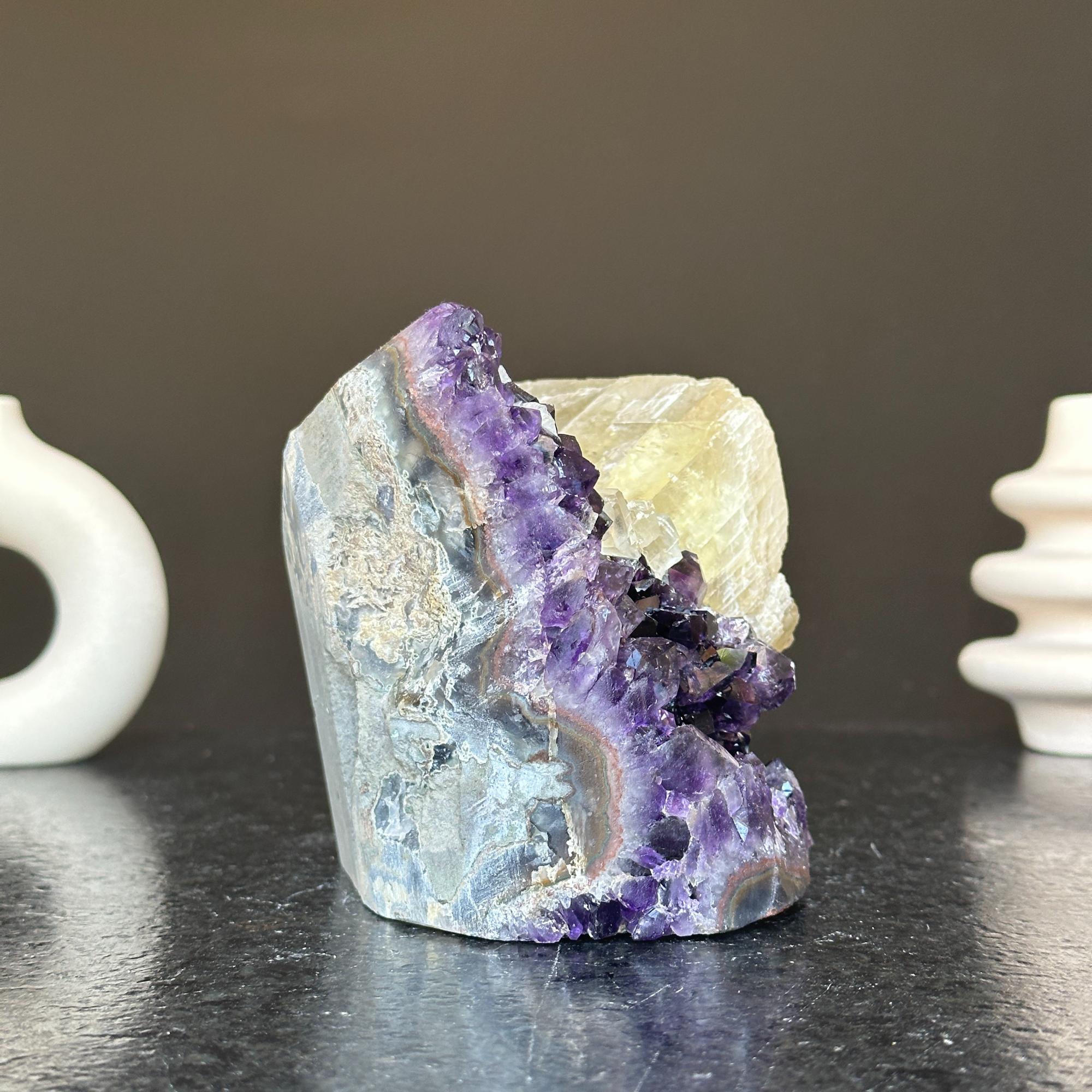 Vibrant deep purple amethyst geode cluster with grey banded rock and yellow crystal, 5.5 inches tall.