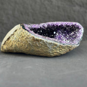 Amethyst geode on a dark gray background