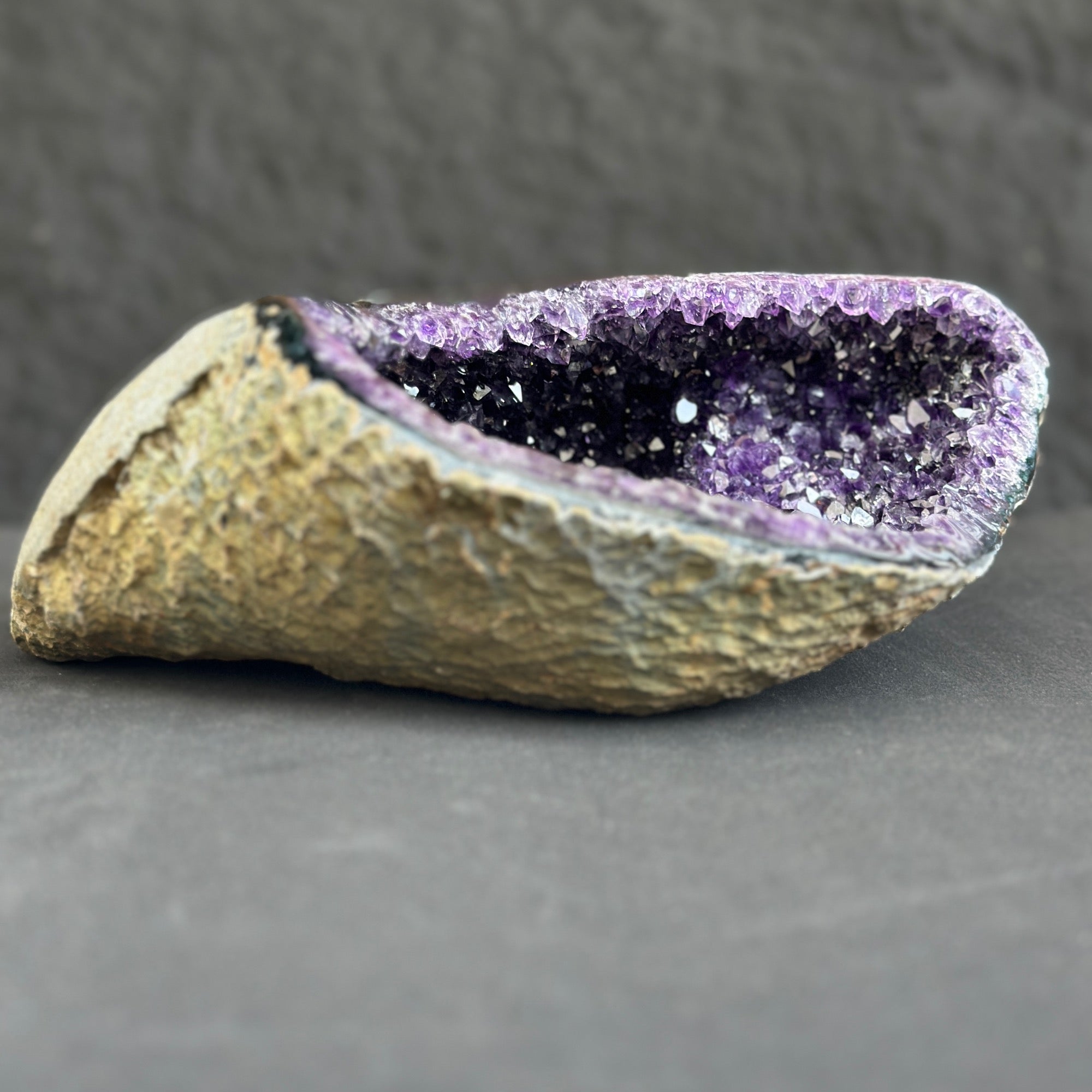 Amethyst geode on a dark gray background