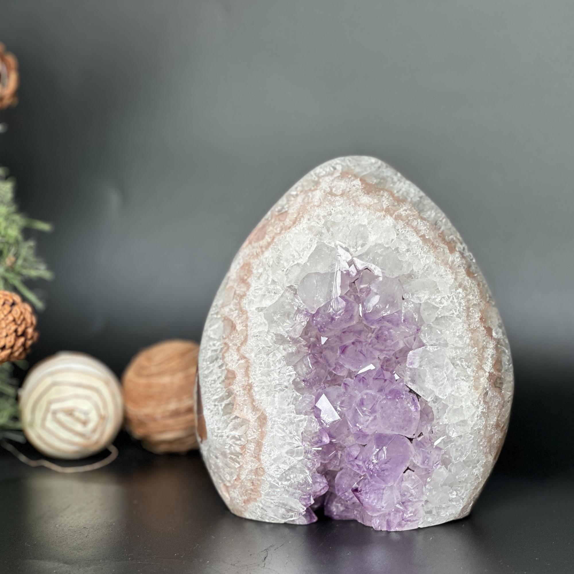 7-inch Uruguayan amethyst and agate geode cave with vibrant purple crystals and white outer layers.