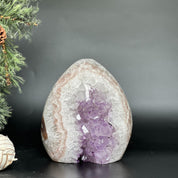 7-inch Uruguayan amethyst and agate geode cave with vibrant purple crystals and natural white-pink banding.
