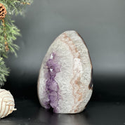 7-inch Uruguayan amethyst and agate geode cave with vibrant purple crystals.