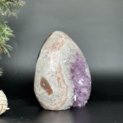 7-inch Uruguayan amethyst and agate geode cave with vibrant purple crystals and white-pink banding.