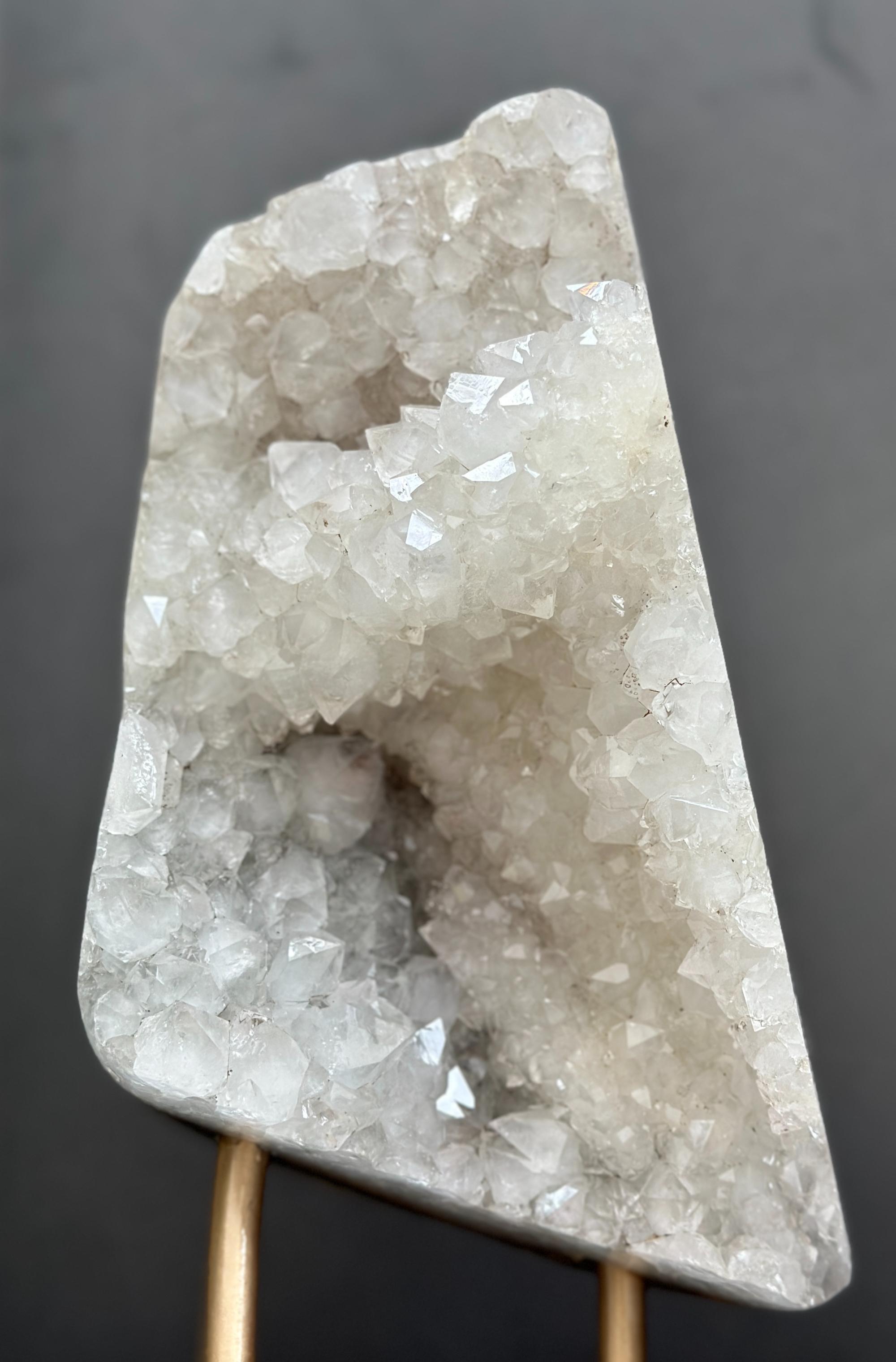 Crystal geode on a stand against a dark background