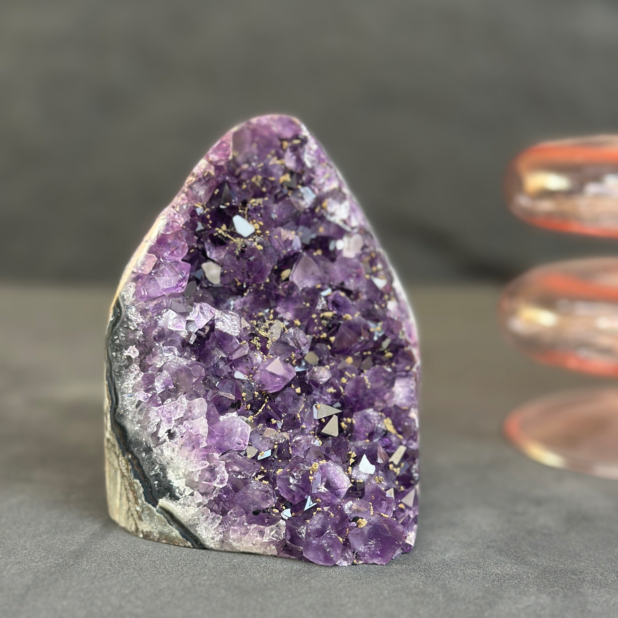 Amethyst crystal on a dark surface