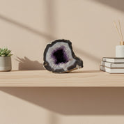 Geode on a wooden shelf with a minimal background
