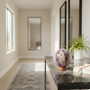 Decorative crystal ball on a table in a modern living room.