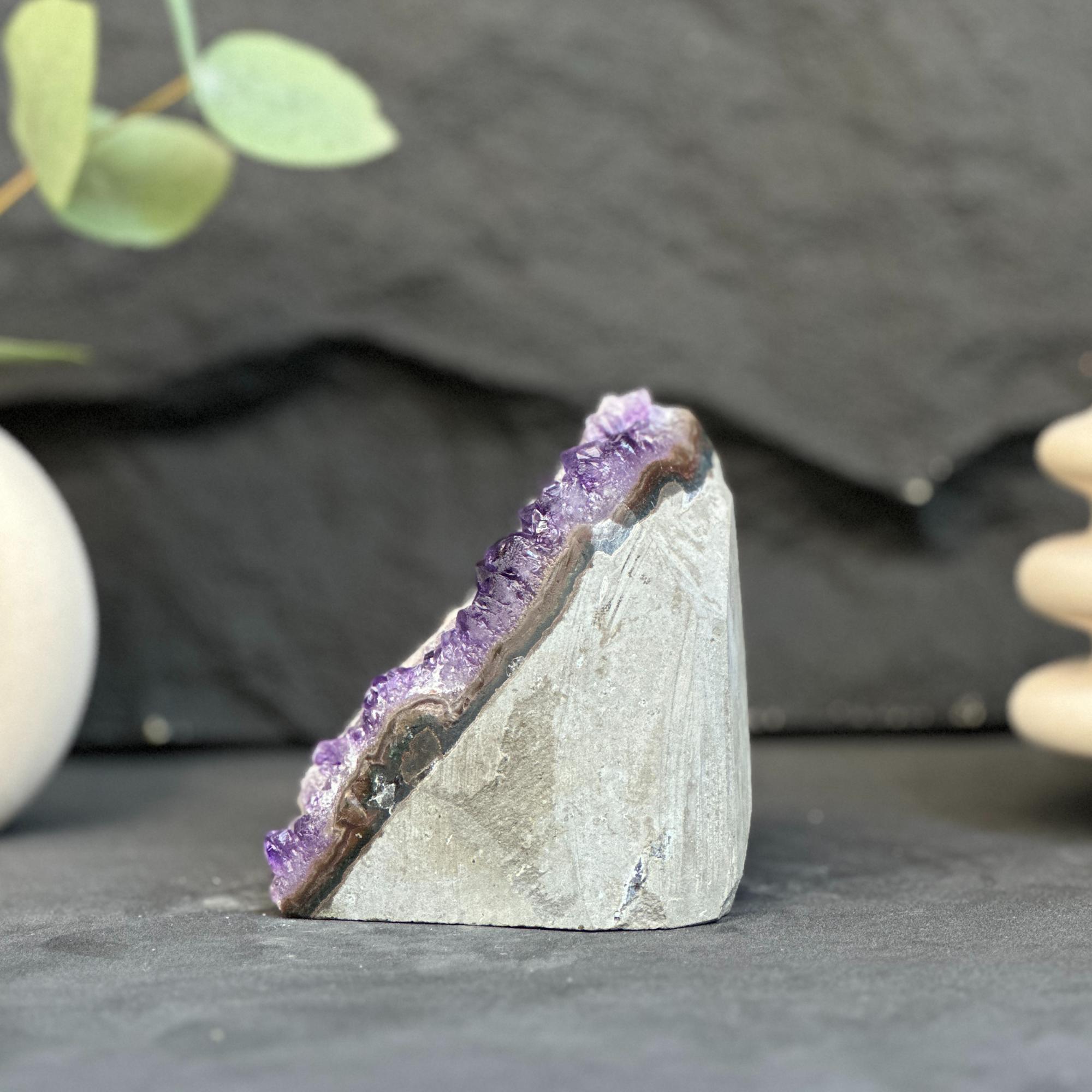Geode with purple interior on a dark surface