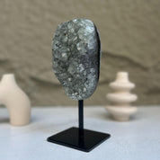 Decorative crystal on a stand with a blurred background