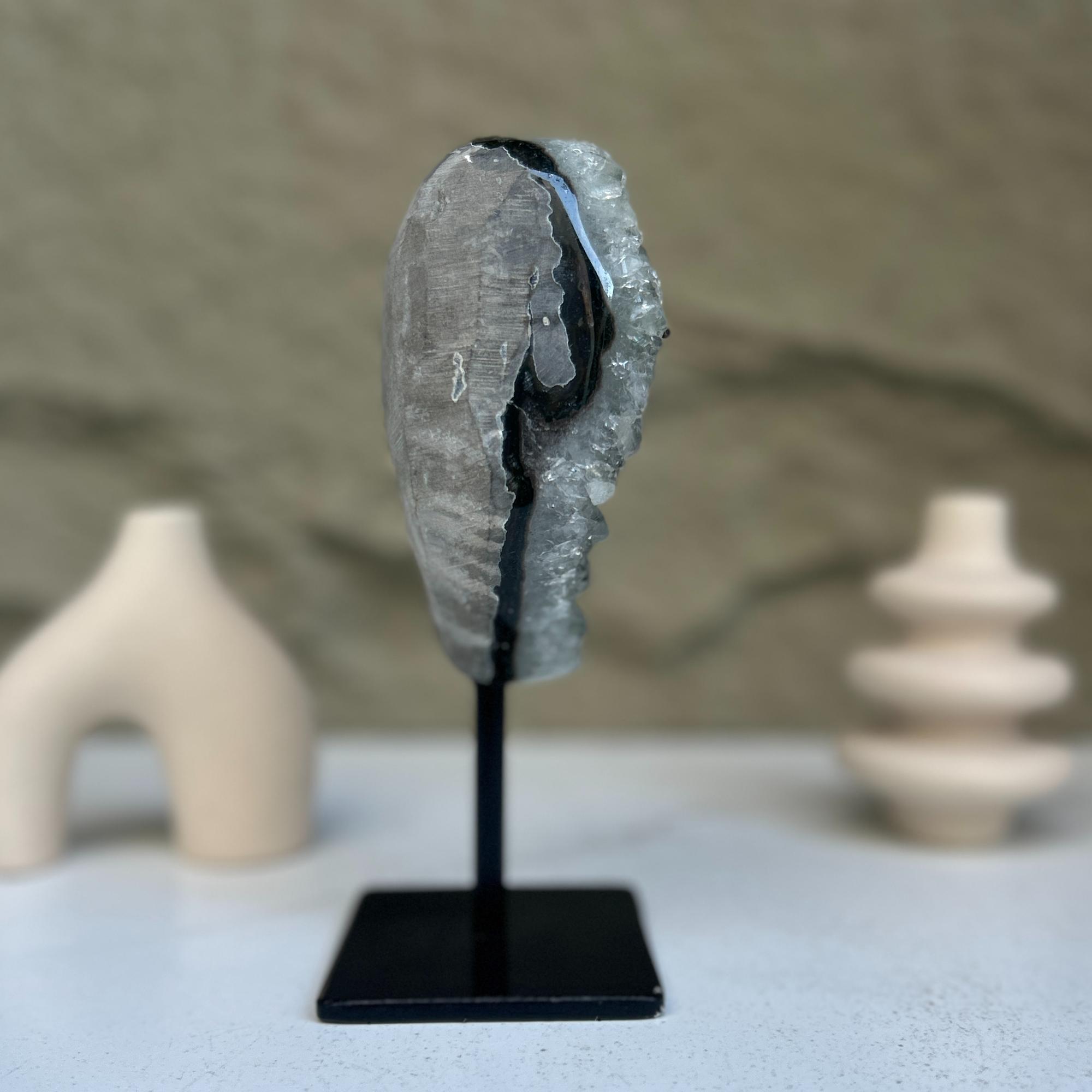 Crystal rock on a black stand with a blurred background