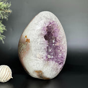 DeepPurpleProject Natural Amethyst Geode Cave with purple crystals and white quartz exterior, egg-shaped, for home decor.