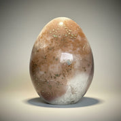DeepPurpleProject Natural Amethyst Geode Cave egg, a decorative crystal with earthy brown and white tones, ideal for home decor.