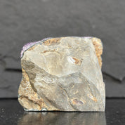 Mineral sample on a dark background