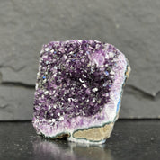 Amethyst crystal on a dark gray background