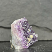 Amethyst crystal on a dark gray background