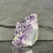 Amethyst crystal on a dark gray background