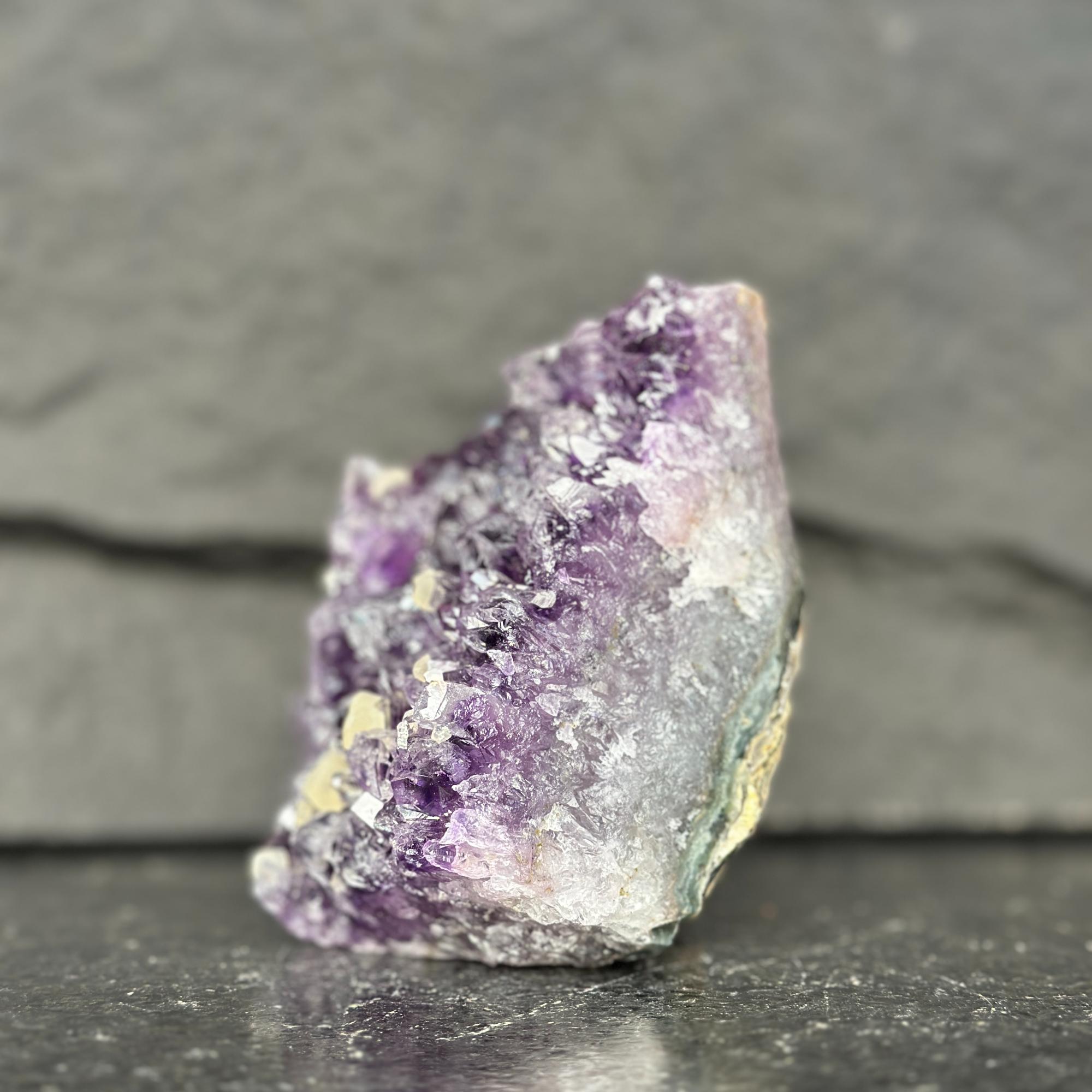 Amethyst crystal on a dark gray background