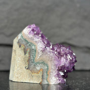 Amethyst crystal formation on a dark background