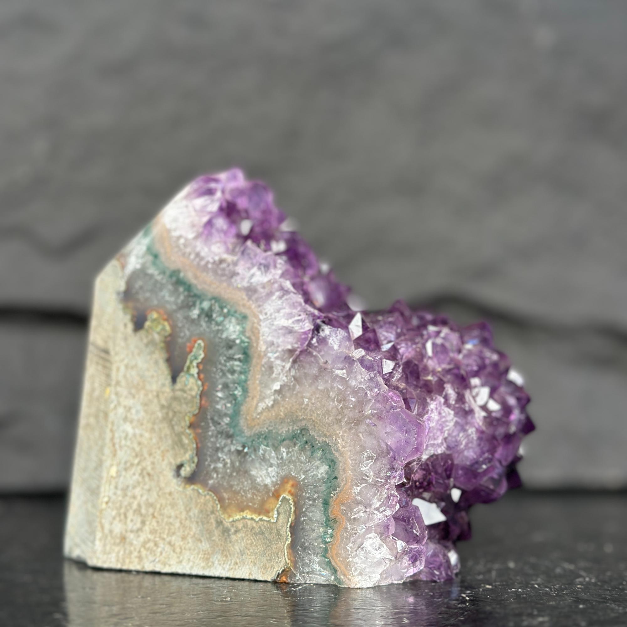 Amethyst crystal formation on a dark background