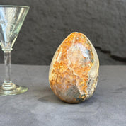 Decorative stone with a glass goblet on a dark surface