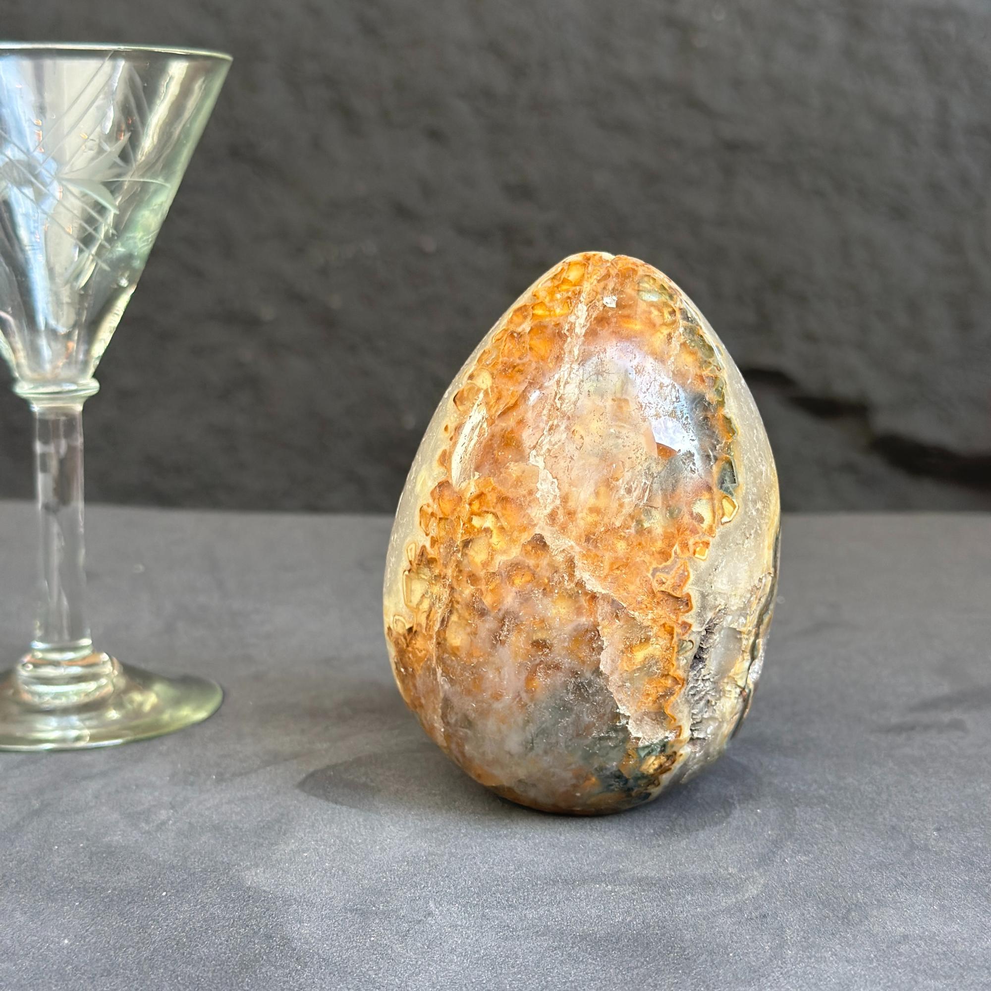 Decorative stone with a glass goblet on a dark surface