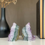 Pair of raw amethyst crystal bookends with sparkling purple points and green-gray agate bands.